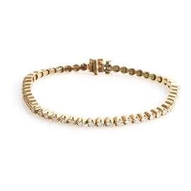 Vintage 14K Yellow Gold and 2.00 CTW Diamond Tennis Bracelet: A vintage 14K yellow gold and 2.00 ctw round brilliant cut diamond tennis bracelet.