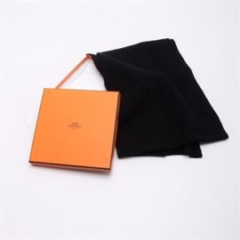 Hermès Black Cashmere Muffler: An Hermès black cashmere scarf featuring a textural diamond pattern. Brand and fabric care labels are hand sewn to one edge. The scarf comes wrapped in tissue in the original orange box.