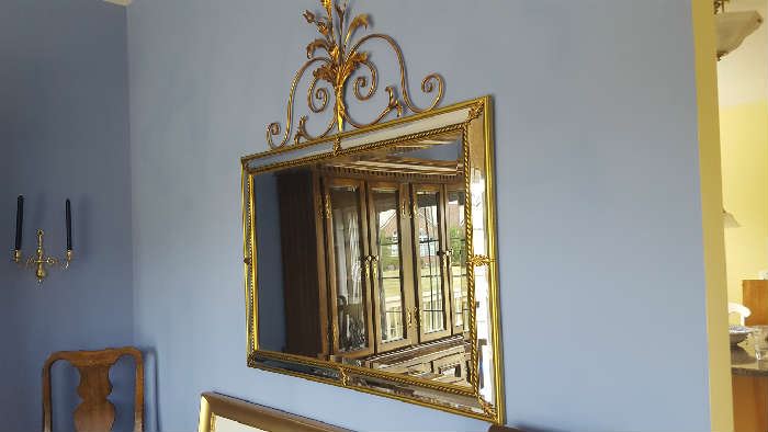 Pretty gold trimmed mirror with metal decor