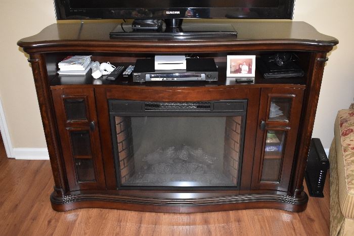  Cherry wood FREE STANDING ELECTRIC FIREPLACE was SOLD on line prior to the one day sale.   