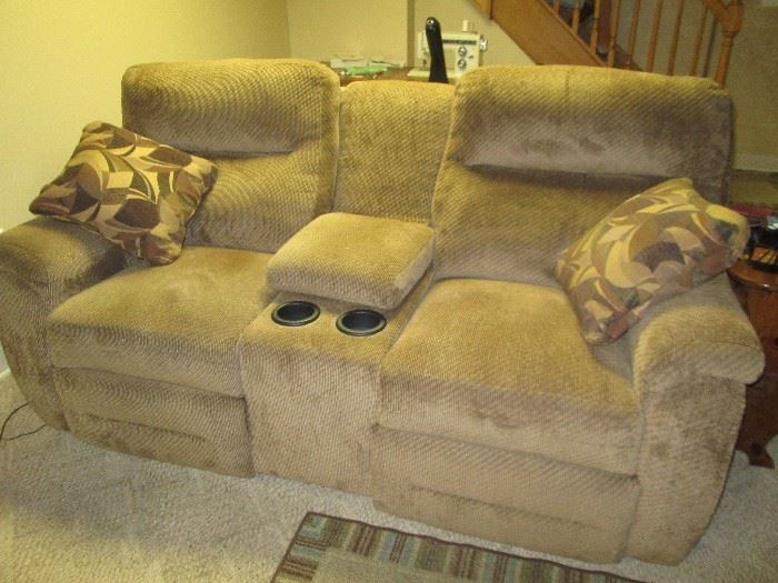 Dual reclining sofa with center storage