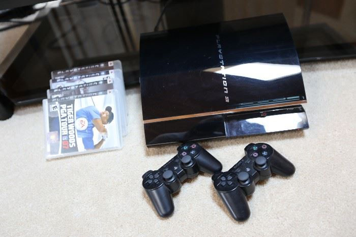 Sony PlayStation 3, two controllers and games
