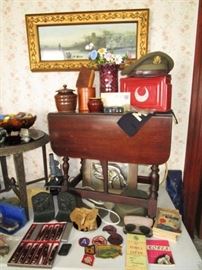 Military collectibles, knives (new in boxes), B & H bronze finish bookends, drop down side table, metal w/ glass top table