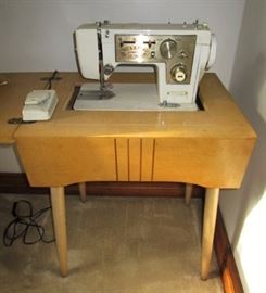 Vintage JC Penneys sewing machine in cabinet