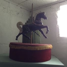 Electric horse on pedestal goes up and down.