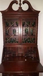 Antique secretary with rounded wood front