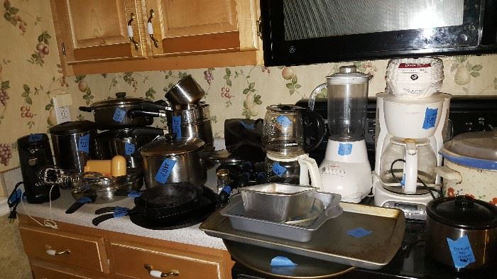 Tons of kitchen items...cast iron pots and pans, appliances, etc