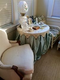 Again, this house is full of surprises!  Just when I thought I was over skirted tables I am debating this silk dressed beauty for Emily's room...the hammered metal French Provincial top is literally the icing on the cake!