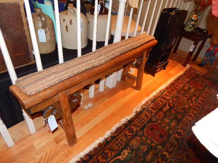 Antique bench with cushion