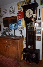 Tall case clock with vintage whiskey advertising