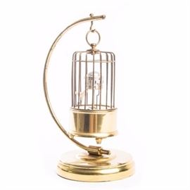 Kaiser Germany Automaton Bird Alarm Clock: An antique to vintage brass birdcage automaton alarm clock by J. Kaiser, Germany. This clock depicts a small bird cage that is hanging on a curved stand. It has a small red cream and brown bird in the bottom with a second and minute counter and the hours are displayed to the base of the cage. There is a winding mechanism on the underside and it is marked “J. Kaiser G.m.b.H./Villingen. Germany/No (0) Jewels Unadjusted”.