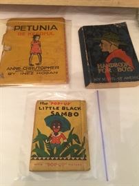 BOY SCOUT HANDBOOK, LITTLE BLACK SAMBO BOOK, AND A PETUNIA BOOK