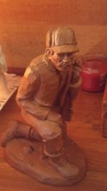 Wood carving of hunter