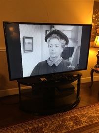 Large flat secret TV showing Aunt Bea