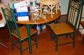 ROUND DROP LEAF TABLE WITH THREE CHAIRS.  PERFECT FOR A SMALL SPACE