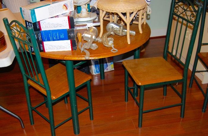 ROUND DROP LEAF TABLE WITH THREE CHAIRS.  PERFECT FOR A SMALL SPACE