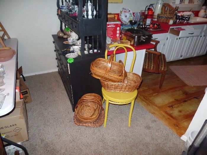Many baskets - Yellow Side Chair - Black Hutch in the Background