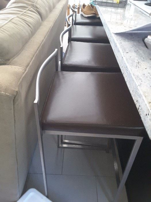 Short Metal Count Bar Stools with brown cushions. From Wayfair.