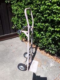 Old stand up Dolly. Sturdy and can be used standing up or lying down.