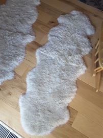 Small floor rug, sheepskin, there are 2 of these. These may be vacuumed. Also may be washed delicate cycle and air dry.