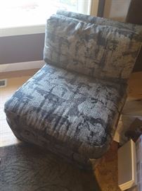 Arm less sitting chair open - black upholstery. Macy's 1990. Grey pattern and design.