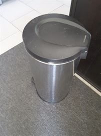 Small metal garbage can.