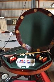 Game table. When top is down, it has a mahoghany finish flat top.