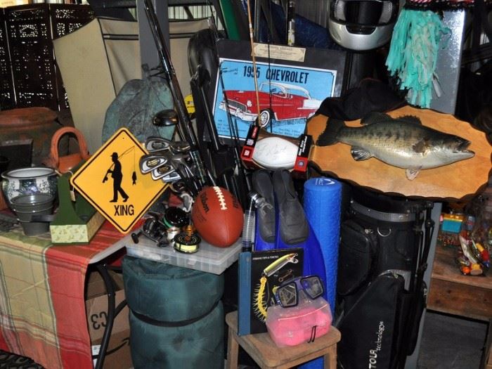 Sporting equipment including golf clubs and bag, fishing poles, reels and lures, sleeping bag, fish trophy, snorkeling gear, motorcycle helmet, signed football.