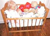 Cabbage Patch Dolls & other dolss in bassinet