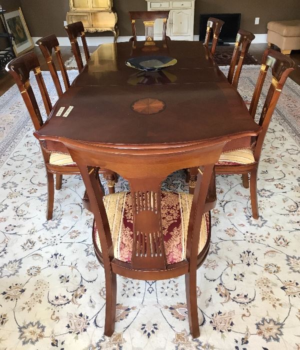 Large table with leaves and beautiful inlay. Ten chairs.