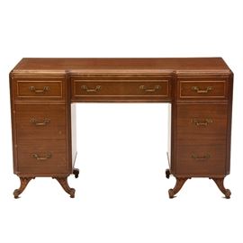 Vintage Mahogany Kneehole Desk by Rway: A vintage mahogany kneehole desk, by Rway. The rectangular top has a molded edge, over a center drawer and two pedestals with canted and fluted corner stiles, each having three drawers, on carved saber feet.