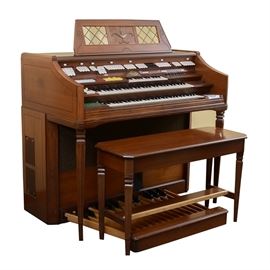 Wurlitzer Orbit III Synthesizer Organ: A Wurlitzer Orbit III Synthesizer organ with a walnut finish, three rows of keys with synthesizer, a built-in drum machine with presets including Waltz and Jazz Waltz, a built-in solid state Bell & Howell cassette recorder, multiple foot pedals and much more.