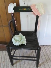 Vintage wicker seat painted chair with bonnets in the second bedroom upstairs