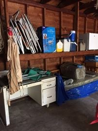 lawn chairs, small refrigerator, metal desk, sofa bed