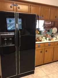 side by side black refrigerator