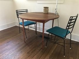 Mid-century dining table - a very special piece indeed. This petite table was handmade by a WWII veteran and features his hallmark/signature on the underside of the table. A very classic piece! An Artemide light from Italy is attached and is sold separately.
