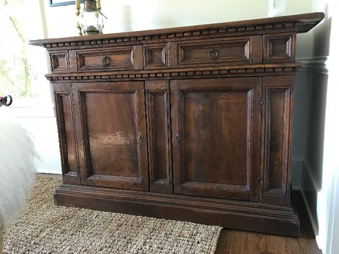 18th c. Italian credenza/sideboard.  Beautiful, patinaed Walnut, all circa 1730.  Original handcrafted locking mechanism.  A very, very rare find.  See similar example here: https://www.1stdibs.com/furniture/storage-case-pieces/credenzas/italian-tuscan-17th-century-walnut-credenza-baroque-credenza/id-f_752562/