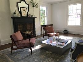 A pair of Ib Kofod Larsen armchairs, made by Selig. Beautiful French-style canapé from Ashley Gilbreath's shop Parish. Note the handsome Hepplewhite writing table in the background and the French jardinière under the window at right. Sadly the Oushak rug is not for sale as it conveys to new owner of home - the coffee table is also not for sale.