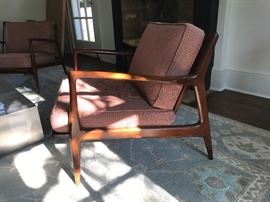 A pair of armchairs by Ib Kofod Larsen for Selig. For more information, please see this example: https://www.1stdibs.com/furniture/seating/lounge-chairs/danish-lounge-chairs-ib-kofod-larsen/id-f_4473483/