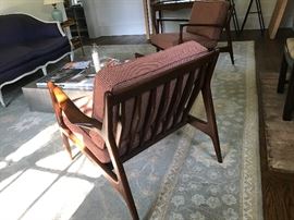 A pair of armchairs by Ib Kofod Larsen for Selig. For more information, please see this example: https://www.1stdibs.com/furniture/seating/lounge-chairs/danish-lounge-chairs-ib-kofod-larsen/id-f_4473483/