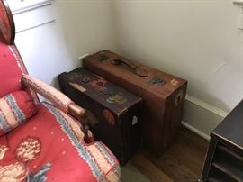 A pair of English suitcases, covered in early 20th c. travel stickers from across Europe.
