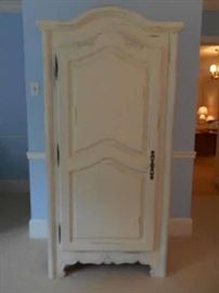 Bedroom #3-Upstairs:  The creamy white arch top armoire is 36" wide x 20" deep x 72" tall.  A photo of the interior follows.