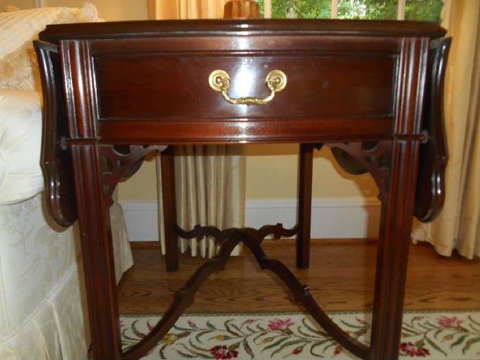 Living Room:  A front view of the HICKORY mahogany Chippendale-style drop leaf Pembroke table.  Notice the raised stretchers.  It is 21" wide x 32" deep x 28" tall. Each leaf is 11" wide.