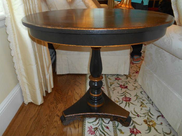 Living Room:  A beautiful black/gold 31" round x 28" tall pedestal table.  Great piece for a center hall.