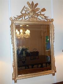 Dining Room:  The Country French gold frame, beveled mirror measures 28" wide x 46" tall.