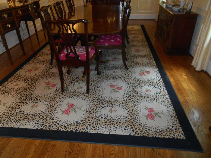 Dining Room:  The gorgeous custom made STARK animal print rug ("Leopard Rose Petite") has a black border with a leopard/floral pattern.  It measures 8'  8"  x  15'  11."  Keep in mind that rugs can be re-designed (cut and re-sized) to fit your unique room. 