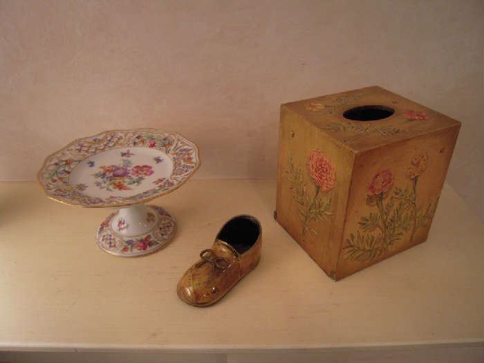 Kitchen-SMALLS Area:  From left to right:  A DRESDEN compote (originally purchased at SMALL WORLD ANTIQUES in Ladue); an enameled/leather sole baby shoe; and a wooden Kleenex box with the following written on the bottom:  "Hand painted in England by Winston Yeatts of Warwickshire."