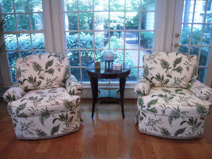Sun Room:  Two EDWARD FERRELL fern print occasional chairs flank a WOODBRIDGE FURNITURE COMPANY round side table with under-shelf (24" round x 27" tall).