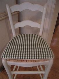 Sun Porch:   The counter stool is now shown with a green check cushions which has cord ties. Each cushion is priced separately from the stool.