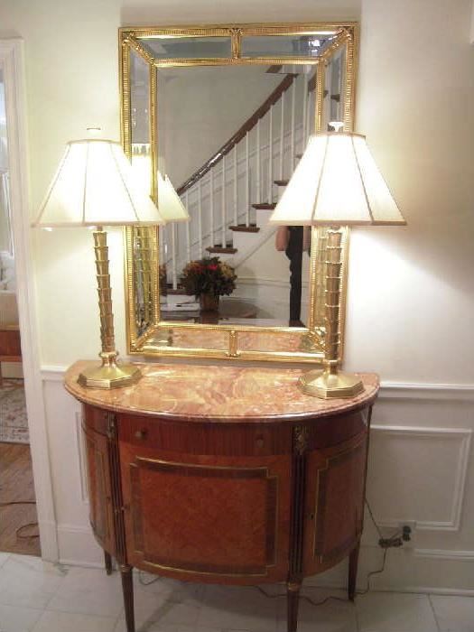 Foyer:  The Italian demi-lune commode (Baggio) is a definite show-stopper.  The beveled mirror (32" x 46") with mirror panels and the heavy gold lamps add to the "WOW" of this piece.